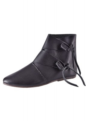Chaussure viking Jorvik noire vue de profil sur fond uni, en cuir avec tige montante et fermeture par boutons roulés en cuir