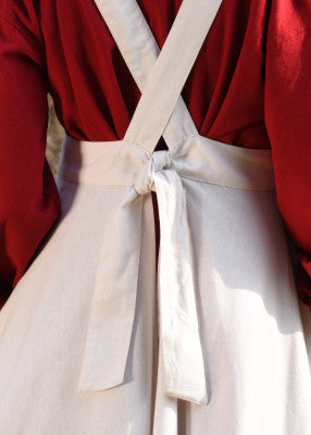 Tablier Ruth médiéval - coloris naturel, coton naturel, gros plan du nœud au dos, bretelles croisées, reconstitution GN LARP